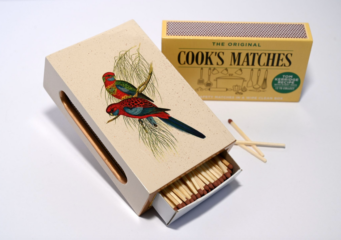 pair of parrots matchbox cover with matches inside and next to