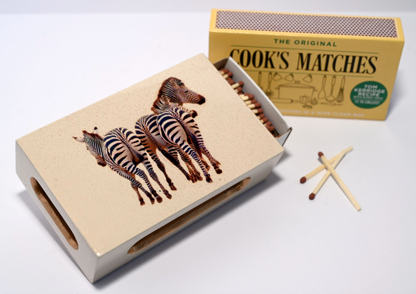 zebra matchbox cover with matches inside and next to box