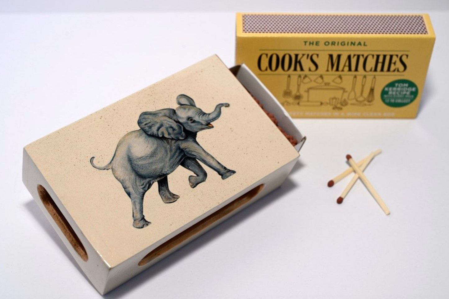 elephant matchbox cover pictured next to cook's matches