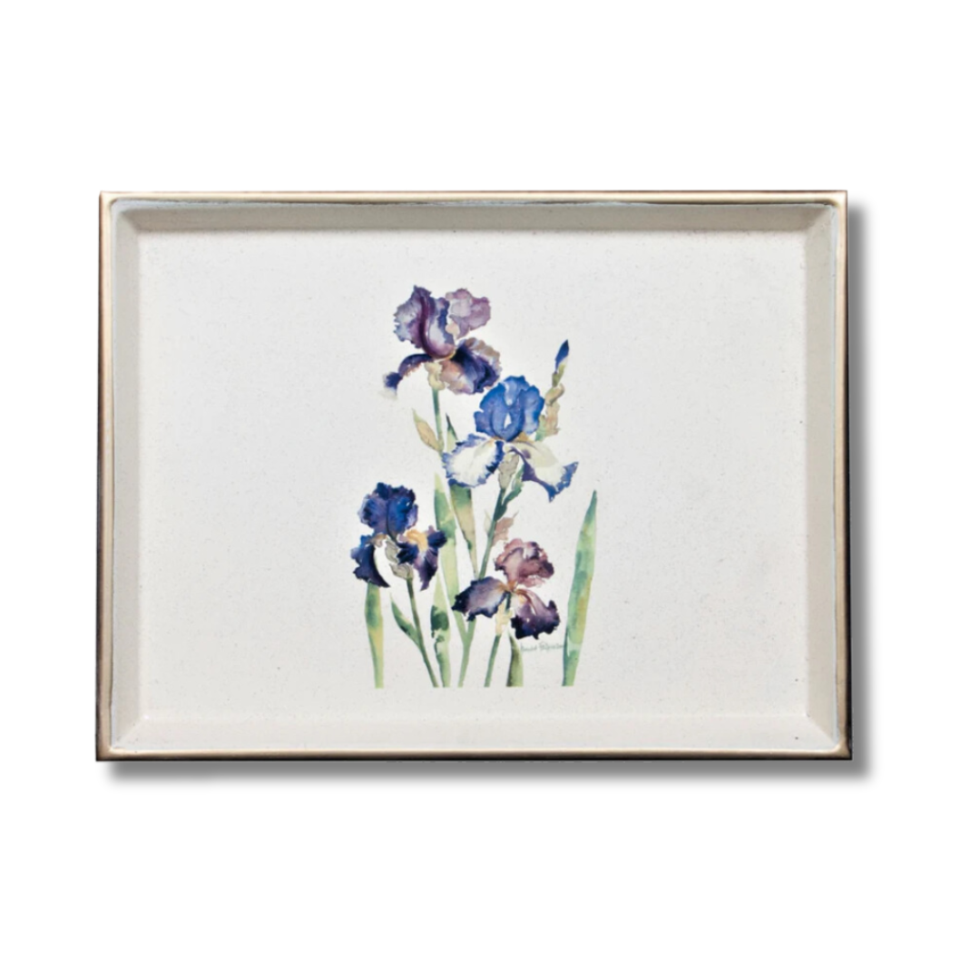 A decorative tray featuring a floral design with irises, bordered by a gold rim and placed in a baize base.